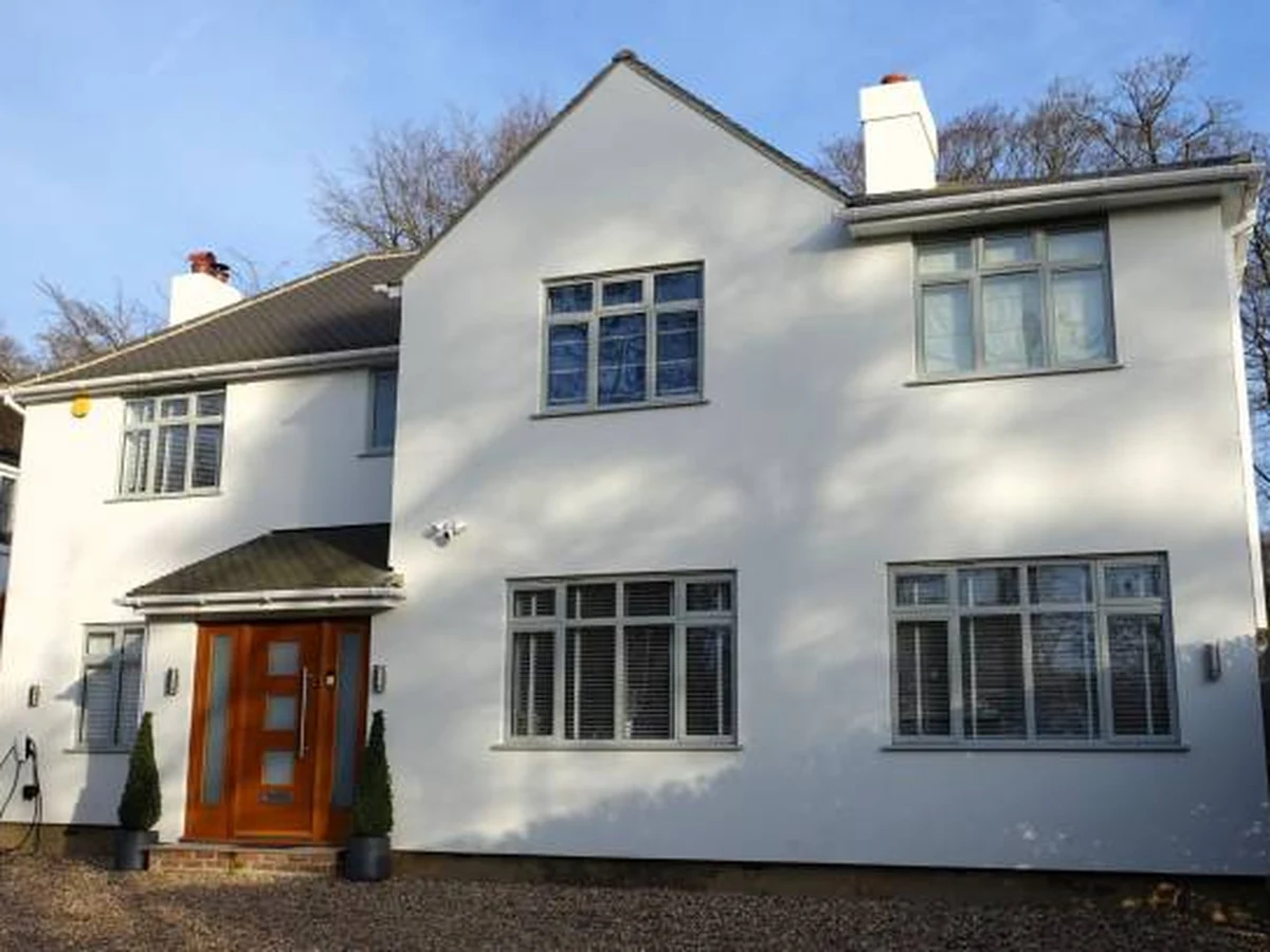 White rendered detached house exterior painting in Sevenoaks by Sevenoaks Painters